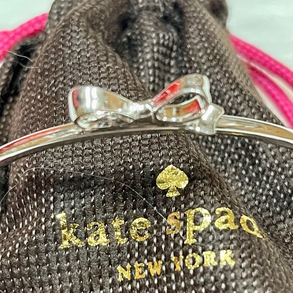 KATE ♠️ SPADE SILVER BOW PUSH BUTTON BANGLE NWOT - Picture 2 of 11